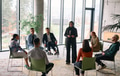 Corporate business team meeting with a manager or coach. Group of happy diverse, multiracial people - PhotoDune Item for Sale