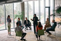 Corporate business team meeting with a manager or coach. Group of happy diverse, multiracial people - PhotoDune Item for Sale