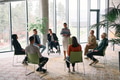 Corporate business team meeting with a manager or coach. Group of happy diverse, multiracial people - PhotoDune Item for Sale