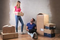 Couple with boxes in a new house - PhotoDune Item for Sale