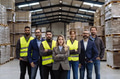 Full team of warehouse employees standing in warehouse. Team of workers, managers, female director - PhotoDune Item for Sale