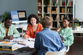 Collaborating in Modern Office Setting with Diverse Group - PhotoDune Item for Sale
