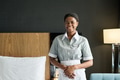 Chambermaid Wearing Uniform Standing in Hotel Room - PhotoDune Item for Sale
