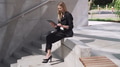 Professional Businesswoman Using Tablet on Concrete Steps - PhotoDune Item for Sale
