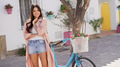 Smiling Woman with Bicycle on a Sunny Spanish Street - PhotoDune Item for Sale
