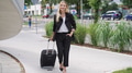 Confident Businesswoman Walking With Suitcase Outdoors - PhotoDune Item for Sale
