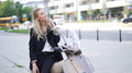 Businesswoman Relaxing on Scooter in Urban Setting - PhotoDune Item for Sale