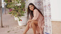 Serene Woman Relaxing in a Tranquil Spanish Street - PhotoDune Item for Sale