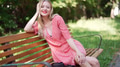 Happy Young Woman Smiling on Park Bench in Summer - PhotoDune Item for Sale