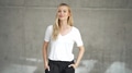 Confident Woman in Casual White T-Shirt Posing - PhotoDune Item for Sale