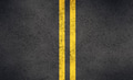 Asphalt road with bright yellow double lines and cracks - PhotoDune Item for Sale