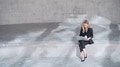 Professional Woman Working on Laptop in Minimalistic Setting - PhotoDune Item for Sale