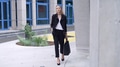 Confident Businesswoman Walking in Urban Setting - PhotoDune Item for Sale