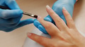 Manicurist paints nails with gel polish. Application of acrylic polish on nails. - PhotoDune Item for Sale