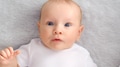 Child face of a Happy newborn baby looking to camera. Face of a Beautiful active tiny child. - PhotoDune Item for Sale