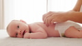 Mother doing massage on her healthy infant baby. - PhotoDune Item for Sale