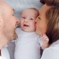 Happy parents with his newborn baby, top view. Happy family. - PhotoDune Item for Sale