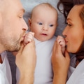 Happy parents with his newborn baby, top view. Happy family. Healthy newborn baby with mom and dad. - PhotoDune Item for Sale