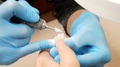 Manicurist in process of removing gel polish or acrylic from nails using manicure machine. - PhotoDune Item for Sale