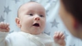 Newborn baby happy to looking on his mom. Happy mother spends time with her child. - PhotoDune Item for Sale