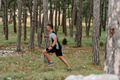 Determined Man Conquering Forest Obstacles with Grit and Speed - PhotoDune Item for Sale