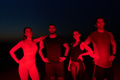 Diverse Athletes Unwind: Post-Marathon Rest Under Red Nighttime Glow. - PhotoDune Item for Sale