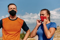 Couple running in nature at morning wearing protective face masks - PhotoDune Item for Sale