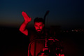 Nighttime Capture: Professional Videographer Films Athletes Running in Red-Lit Darkness - PhotoDune Item for Sale