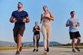 A group of friends maintains a healthy lifestyle by running outdoors on a sunny day, bonding over - PhotoDune Item for Sale