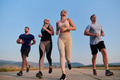 A group of friends maintains a healthy lifestyle by running outdoors on a sunny day, bonding over - PhotoDune Item for Sale